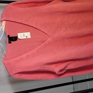 100 percent cotton pullover sweater with long sleeves and deep V neck in fronl